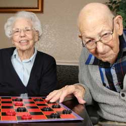 people playing checkers ina nursing home