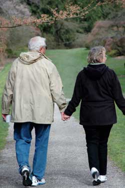 retired couple holding hands